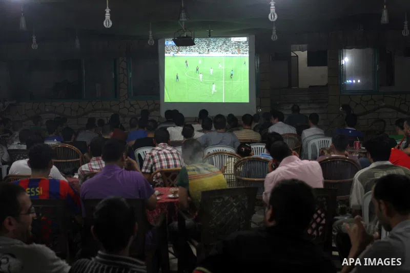 Palestinian Youths follow the match between Barcelona and Real Madrid Super Cup in a cafe yesterday evening in Gaza City on Aug. 14, 2011. Photo by Mohammed Asad