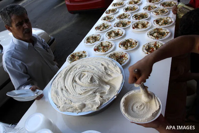 A Palestinian vendor sells chickpeas in his shop in Gaza City on Aug. 15, 2011. Muslims around the world abstain from eating, drinking and conducting sexual relations from sunrise to sunset during Ramadan, the holiest mo...