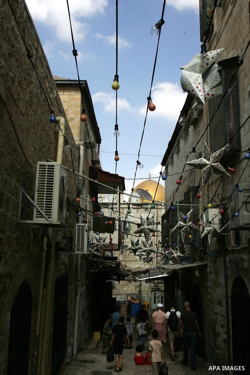 Palestinians walk in the neighborhoods in the Old City of Jerusalem during the holy month of Ramadan on Aug. 14, 2011. Muslims around the world are observing the holy fasting month of Ramadan in which they refrain from e...