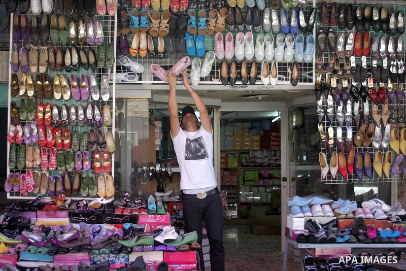 A Palestinian vendor sells Shoes at a shop in the West Bank city of Hebron on Aug. 15, 2011. Muslims around the world abstain from eating, drinking and conducting sexual relations from sunrise to sunset during Ramadan, t...