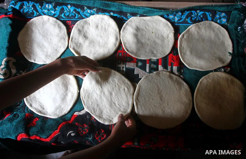 A Palestinian baker prepares loaves of bread at his traditional bakery in the holy month of Ramadan in Gaza City on Aug. 15, 2011. Muslims around the world abstain from eating, drinking and conducting sexual relations fr...