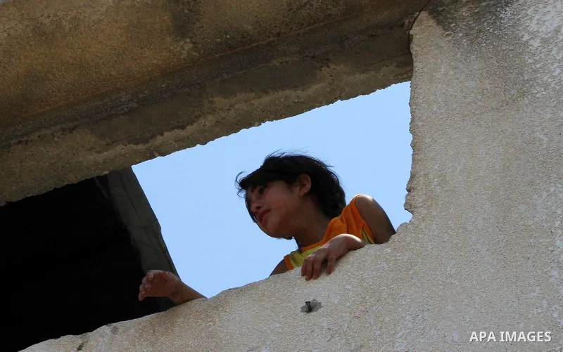 A Palestinian girl cries during the funeral of Moussa Shtewi in Gaza City on August 16, 2011 after he was killed and seven injured by overnight Israeli air strikes across the Gaza Strip, Palestinian medics said. The Isra...