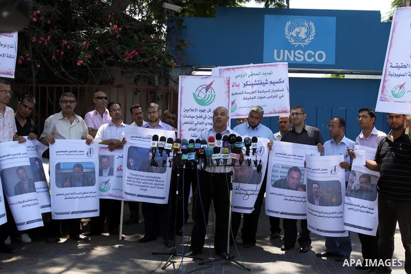Palestinian journalists deliver speech in a protest in support with the Russian journalist, Maxim infront of UNSCO in Gaza city on Aug. 16, 2011. where he threatened with death by one of the leaders of the Russian Jewish...
