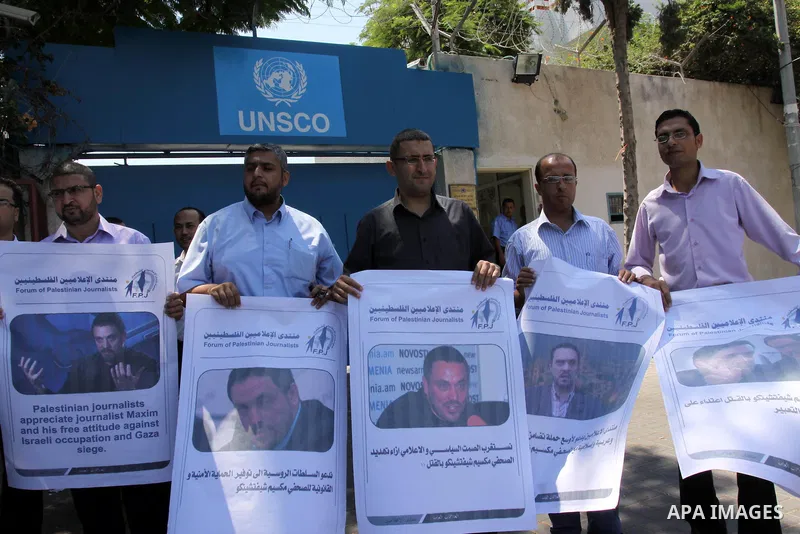 Palestinian journalists take part in a protest in support with the Russian journalist, Maxim infront of UNSCO in Gaza city on Aug. 16, 2011. where he threatened with death by one of the leaders of the Russian Jewish Cong...