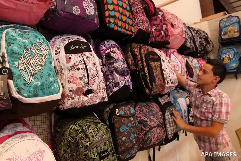Palestinians participate in the opening of an exhibition of national products in Gaza city on Aug. 17, 2011 . Photo by Mohammed Asad