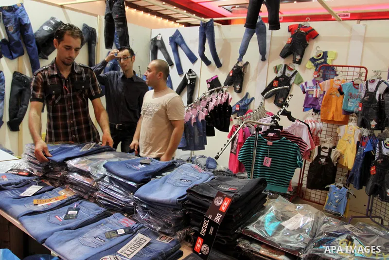 Palestinians participate in the opening of an exhibition of national products in Gaza city on Aug. 17, 2011 . Photo by Mohammed Asad