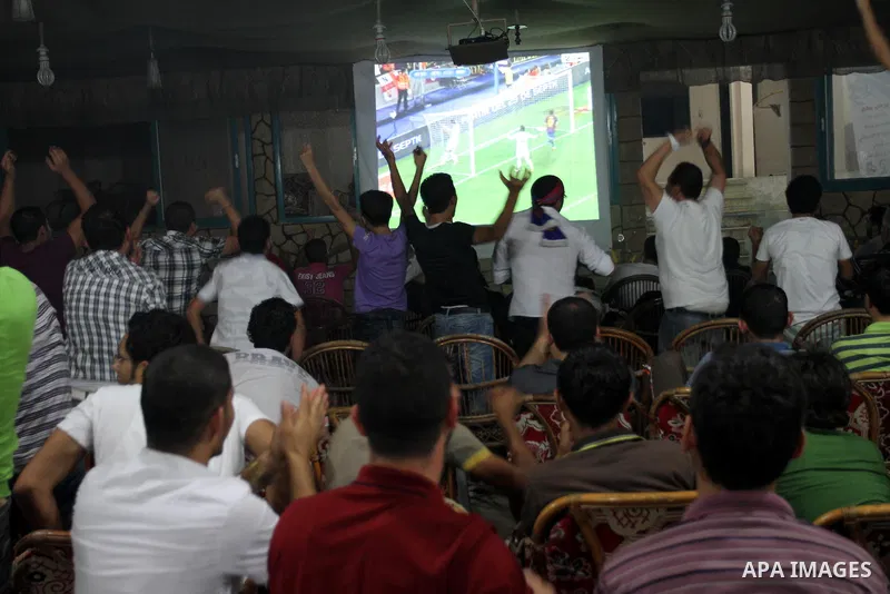 Palestinian Youths follow the Spanish Super Cup at a cafe, yesterday evening in Gaza City on Aug. 17, 2011. Photo by Mohammed Asad