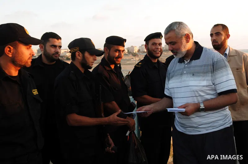 Palestinian Prime Minister in Gaza Strip, Ismail Haniya participates in the meal of "Iftar" with Hamas police, during the seventeenth day of the holiest month of Ramadan in Gaza City on Aug. 17, 2011. Photo by Ahmed Shaa...