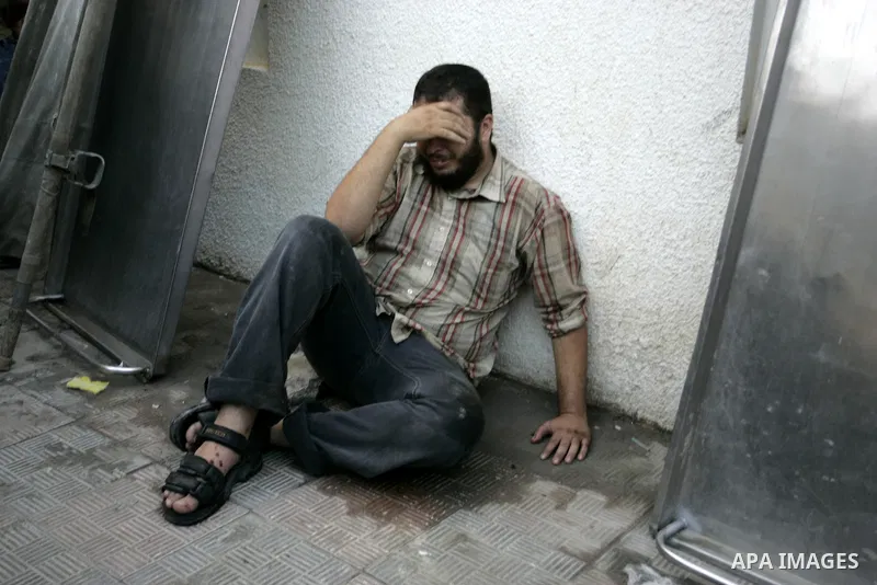 A Palestinian man reacts at a hospital after an Israeli air strike in Rafah in the southern Gaza Strip August 18, 2011. An Israeli air strike killed the leader of an armed Palestinian faction, a top lieutenant and three...