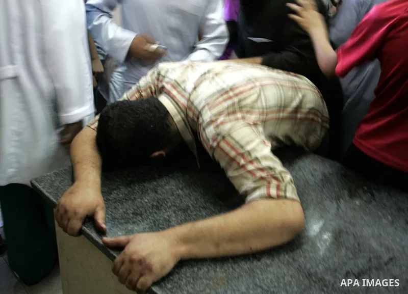 A Palestinian man reacts at a hospital after an Israeli air strike in Rafah in the southern Gaza Strip August 18, 2011. An Israeli air strike killed the leader of an armed Palestinian faction, a top lieutenant and three...