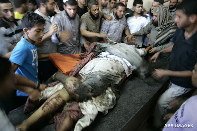 Palestinians react at a hospital after an Israeli air strike in Rafah in the southern Gaza Strip August 18, 2011. An Israeli air strike killed the leader of an armed Palestinian faction, a top lieutenant and three other...