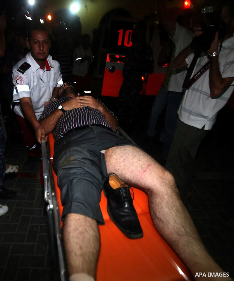 Palestinians transport an injured man to Al-Shifa hospital, after an overnight Israeli air strike, in Gaza City August 19, 2011. Israeli aircraft struck Hamas security installations in Gaza on Friday, killing at least on...
