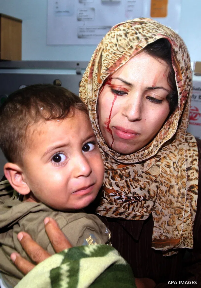 An injured Palestinian woman arrives at Al-Shifa hospital, after an overnight Israeli air strike, in Gaza City August 19, 2011. Israeli aircraft struck Hamas security installations in Gaza on Friday, killing at least one...