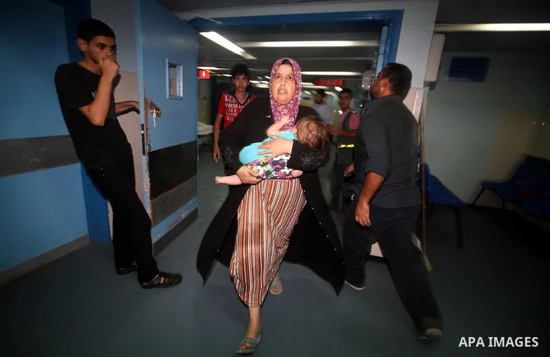 An injured Palestinian woman arrives at Al-Shifa hospital, after an overnight Israeli air strike, in Gaza City August 19, 2011. Israeli aircraft struck Hamas security installations in Gaza on Friday, killing at least one...