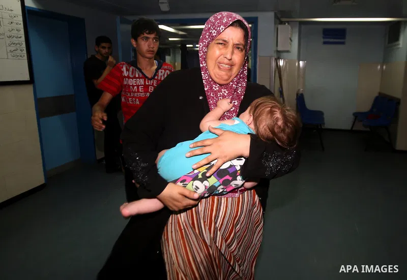 An injured Palestinian woman arrives at Al-Shifa hospital, after an overnight Israeli air strike, in Gaza City August 19, 2011. Israeli aircraft struck Hamas security installations in Gaza on Friday, killing at least one...