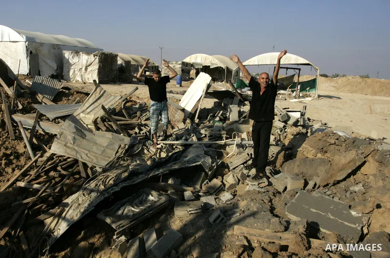 Palestinians inspect the damage to a smuggling tunnel after it was targeted in an Israeli air strike in Rafah, in the southern Gaza Strip August 19, 2011. Israeli aircraft struck Hamas security installations in Gaza on F...
