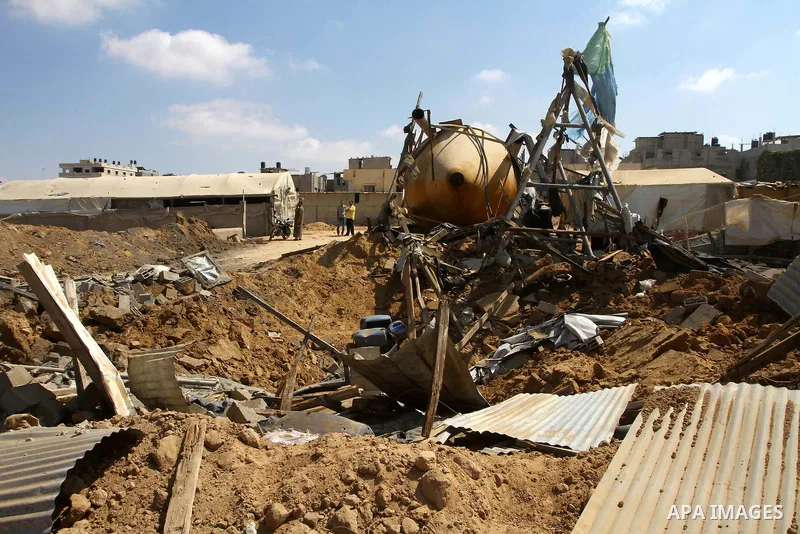 Palestinians inspect the damage to a smuggling tunnel after it was targeted in an Israeli air strike in Rafah, in the southern Gaza Strip August 19, 2011. Israeli aircraft struck Hamas security installations in Gaza on F...