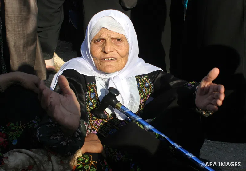 Palestinian Muslims walk through an Israeli checkpoint on the outskirts of the West Bank city of Bethlehem on August 19, 2011 as they wait to cross into Jerusalem to attend on their way to pray at the Al Aqsa Mosque on t...