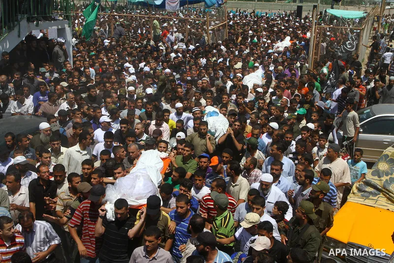 Palestinians carries the bodies of Kamal al-Nairab, the leader of an armed Palestinian faction, and other members during their funeral in Rafah in the southern Gaza Strip August 19, 2011. An Israeli air strike killed the...