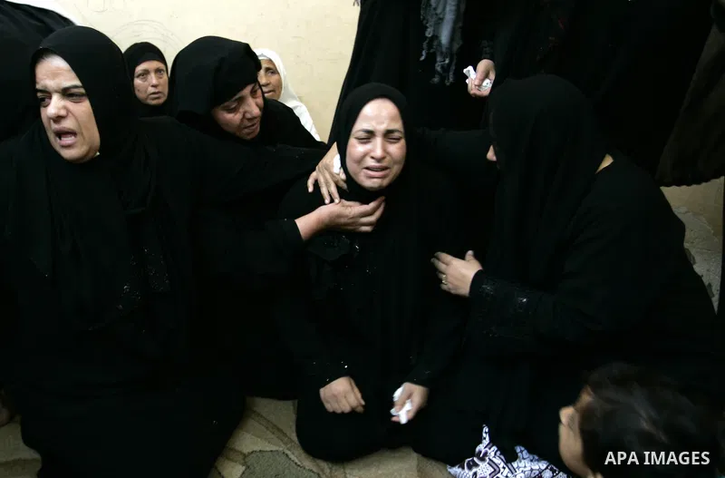 Palestinian relatives mourn during the funeral of the militant Kamal al-Nayrab, secretary-general of the Gaza-based group the Popular Resistance Committees (PRC), in the Rafah refugee camp, southern Gaza Strip, on August...
