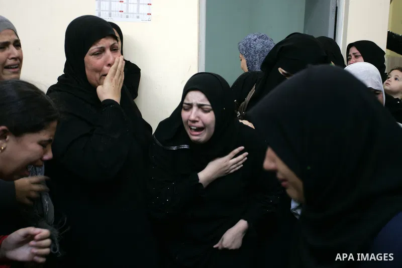 Palestinian relatives mourn during the funeral of the militant Kamal al-Nayrab, secretary-general of the Gaza-based group the Popular Resistance Committees (PRC), in the Rafah refugee camp, southern Gaza Strip, on August...