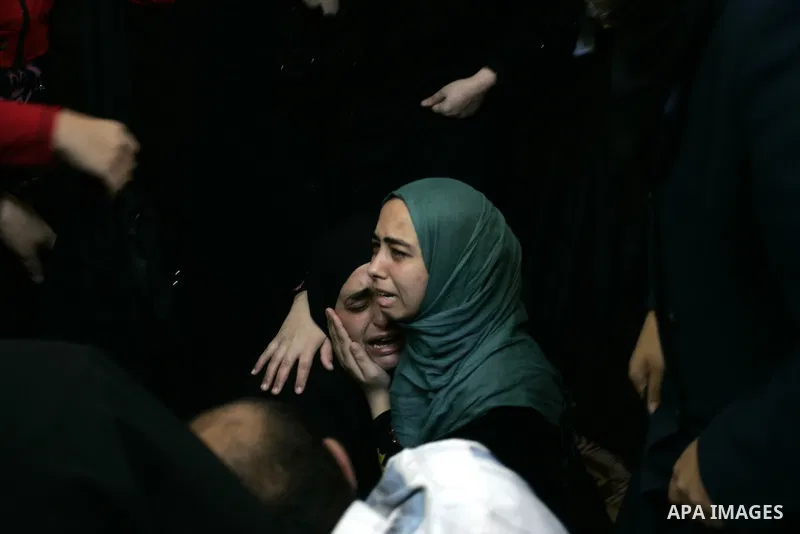 Palestinian relatives mourn during the funeral of the militant Kamal al-Nayrab, secretary-general of the Gaza-based group the Popular Resistance Committees (PRC), in the Rafah refugee camp, southern Gaza Strip, on August...