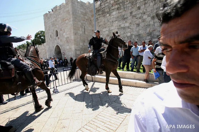 Muslim worshippers run away from Israeli mounted policemen after trying to cross a police barrier near Damascus Gate in Jerusalem's Old City during the third Friday of the holy month of Ramadan August 19, 2011. Israeli s...
