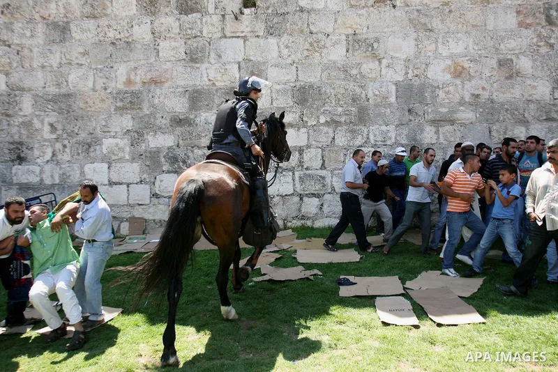 Muslim worshippers run away from Israeli mounted policemen after trying to cross a police barrier near Damascus Gate in Jerusalem's Old City during the third Friday of the holy month of Ramadan August 19, 2011. Israeli s...