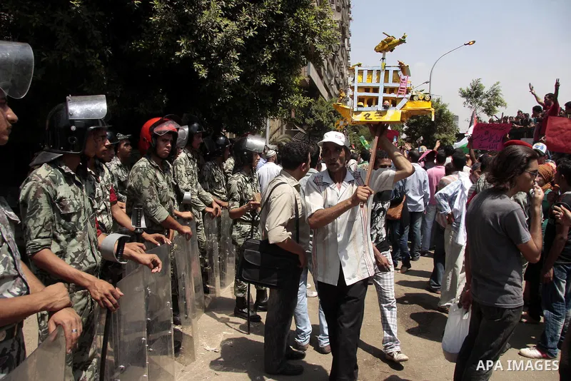 Egyptian protesters shout slogans against Israel during a protest in front of the Israeli Embassy in Cairo, on August 21, 2011. Egypt and Israel sought on Sunday to defuse a diplomatic crisis over the killing of five Egy...