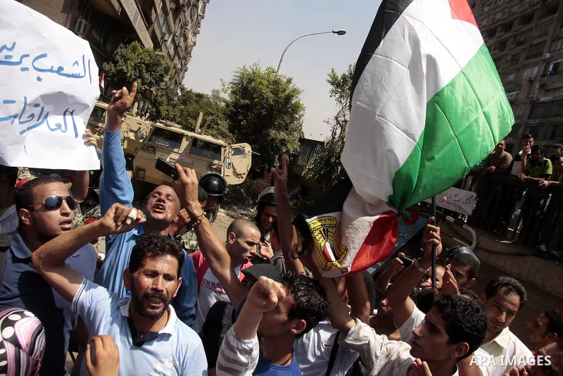 Egyptian protesters shout slogans against Israel during a protest in front of the Israeli Embassy in Cairo, on August 21, 2011. Egypt and Israel sought on Sunday to defuse a diplomatic crisis over the killing of five Egy...
