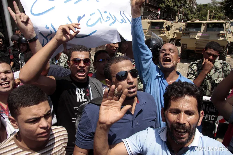 Egyptian protesters shout slogans against Israel during a protest in front of the Israeli Embassy in Cairo, on August 21, 2011. Egypt and Israel sought on Sunday to defuse a diplomatic crisis over the killing of five Egy...