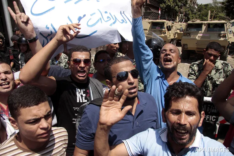 Egyptian protesters shout slogans against Israel during a protest in front of the Israeli Embassy in Cairo, on August 21, 2011. Egypt and Israel sought on Sunday to defuse a diplomatic crisis over the killing of five Egy...