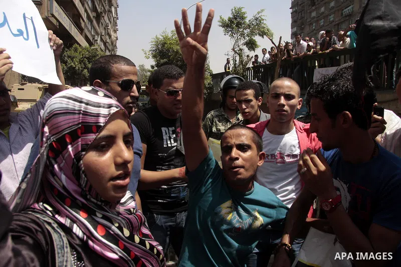 Egyptian protesters shout slogans against Israel during a protest in front of the Israeli Embassy in Cairo, on August 21, 2011. Egypt and Israel sought on Sunday to defuse a diplomatic crisis over the killing of five Egy...
