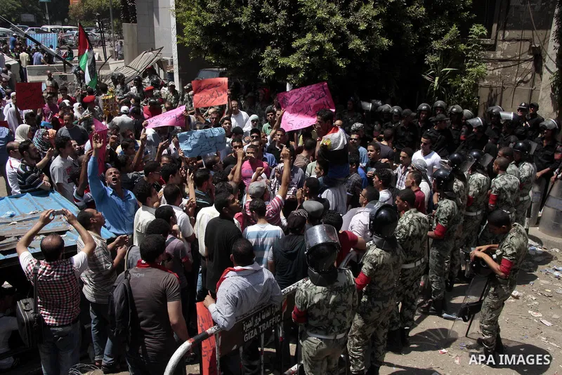 Egyptian protesters shout slogans against Israel during a protest in front of the Israeli Embassy in Cairo, on August 21, 2011. Egypt and Israel sought on Sunday to defuse a diplomatic crisis over the killing of five Egy...
