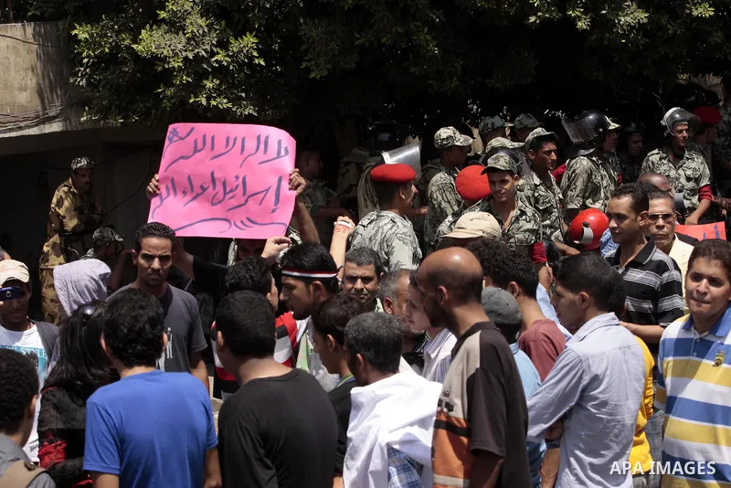 Egyptian protesters shout slogans against Israel during a protest in front of the Israeli Embassy in Cairo, on August 21, 2011. Egypt and Israel sought on Sunday to defuse a diplomatic crisis over the killing of five Egy...