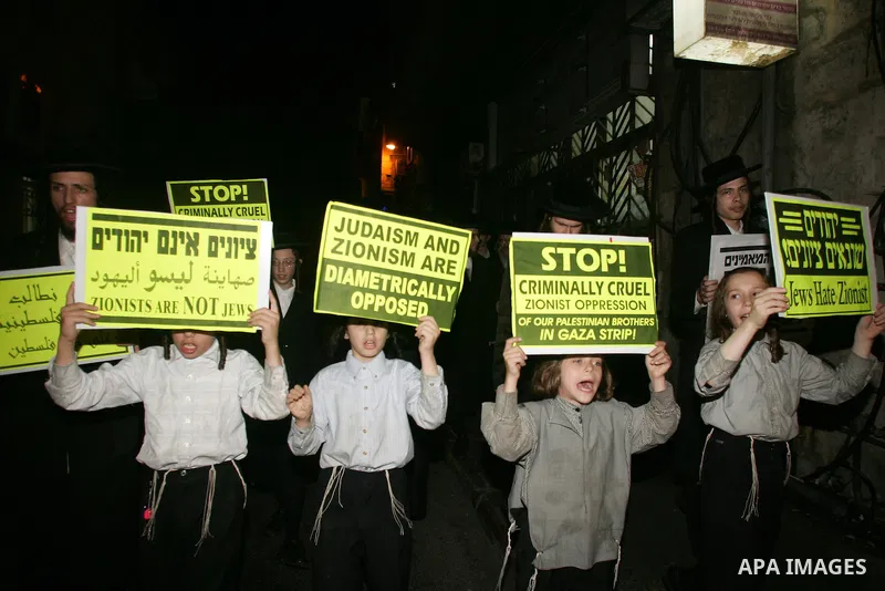 Ultra Orthodox Haredi Jews of the Neturei Karta group take part in a protest against Israeli attacks over Gaza Strip in the west of Jerusalem on Aug. 21, 2011. Photo by Mahfouz Abu Turk