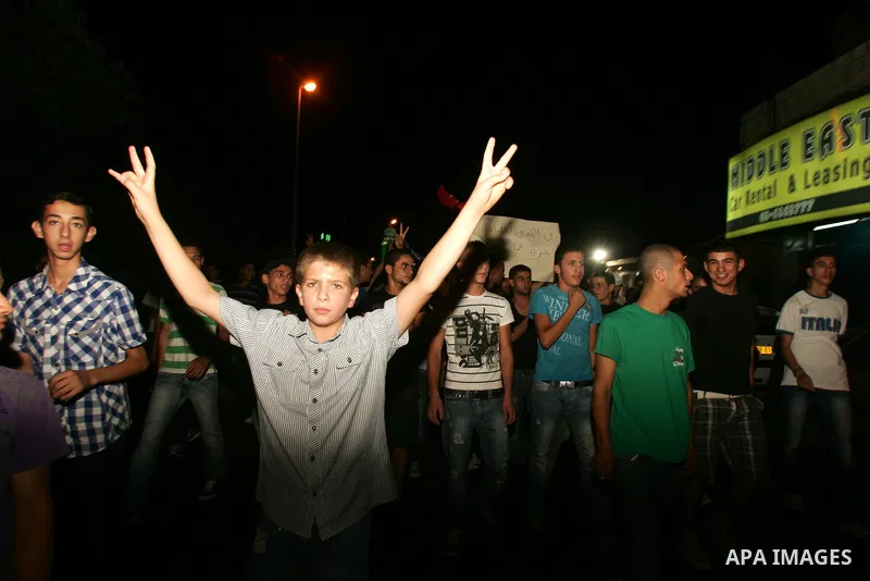 Protesters from several anti-war and pro-Palestinian groups gather at Damascus Gate of the Old City of Jerusalem on Aug. 21, 2011, to protest the disproportionate use of force by the Israeli armed forces during air-strik...