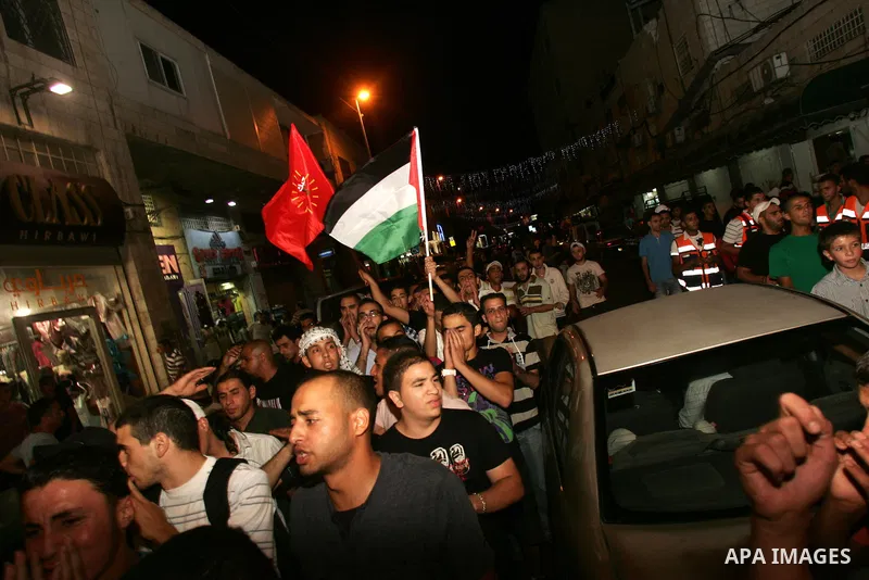 Protesters from several anti-war and pro-Palestinian groups gather at Damascus Gate of the Old City of Jerusalem on Aug. 21, 2011, to protest the disproportionate use of force by the Israeli armed forces during air-strik...