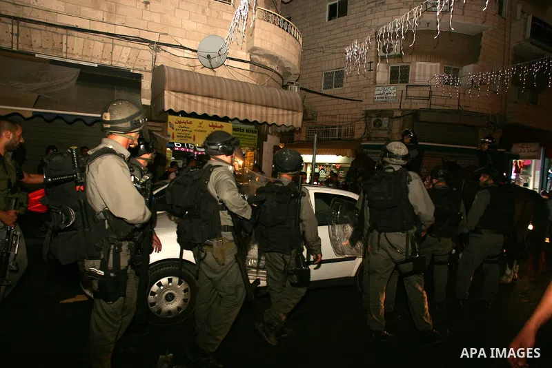 Israeli border policemen stand gaurd during the protesters from several anti-war and pro-Palestinian groups gather at Damascus Gate of the Old City of Jerusalem against Israel's ongoing military operation in the Gaza Str...