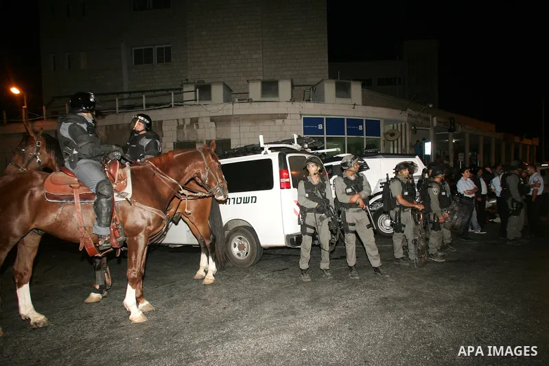 Israeli border policemen stand gaurd during the protesters from several anti-war and pro-Palestinian groups gather at Damascus Gate of the Old City of Jerusalem against Israel's ongoing military operation in the Gaza Str...