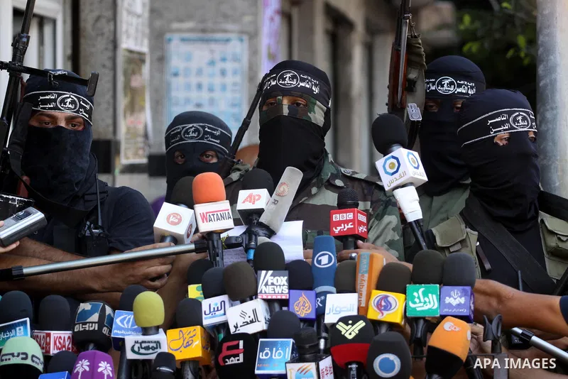 Palestinian militants of the Nasser Salah al-Din Brigades, delivers speech in a press conference, in Gaza city on Aug. 22, 2011. Photo by Mohammed Asad