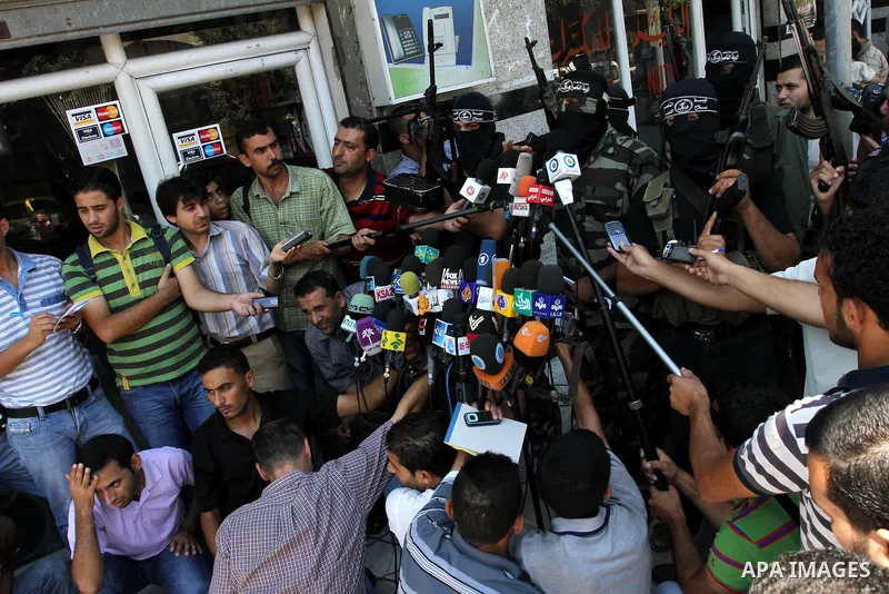 Palestinian militants of the Nasser Salah al-Din Brigades, delivers speech in a press conference, in Gaza city on Aug. 22, 2011. Photo by Mohammed Asad