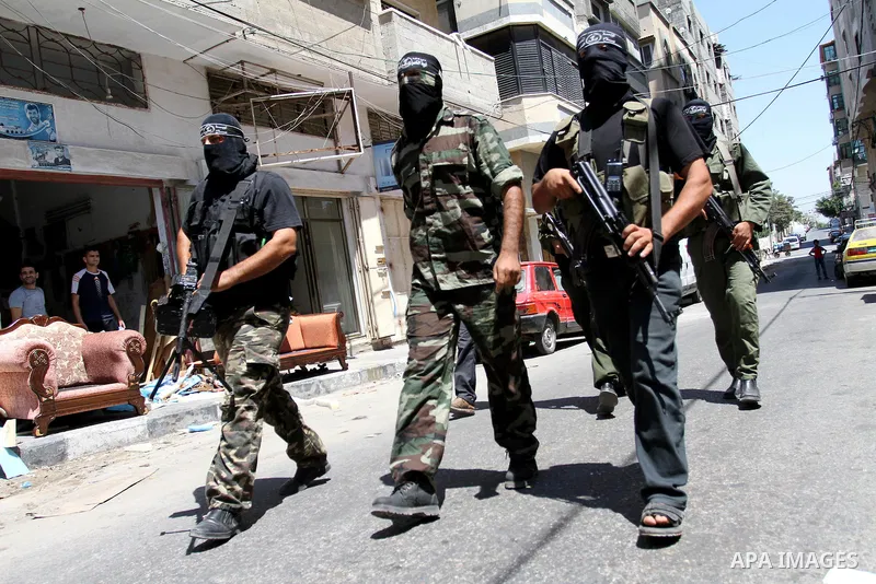 Palestinian militants of the Nasser Salah al-Din Brigades the military wing of the Popular Resistance Committees take part in a press conference, in Gaza city on Aug. 22, 2011 to announce a temporary halt of rocket fire...