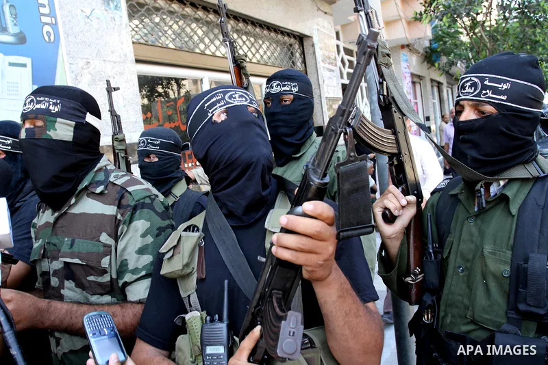Palestinian militants of the Nasser Salah al-Din Brigades the military wing of the Popular Resistance Committees take part in a press conference, in Gaza city on Aug. 22, 2011 to announce a temporary halt of rocket fire...