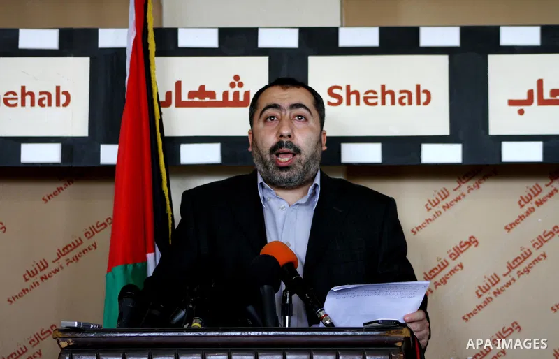 The spokesman of the Palestinian government in Gaza Strip, Taher al-Nono speaks to media in a press conference, in Gaza city on Aug. 22, 2011, to announce about "reached an understanding on a truce and that the truce has...