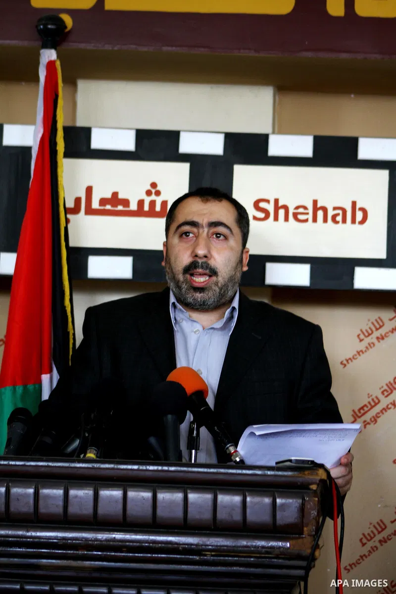 The spokesman of the Palestinian government in Gaza Strip, Taher al-Nono speaks to media in a press conference, in Gaza city on Aug. 22, 2011, to announce about "reached an understanding on a truce and that the truce has...