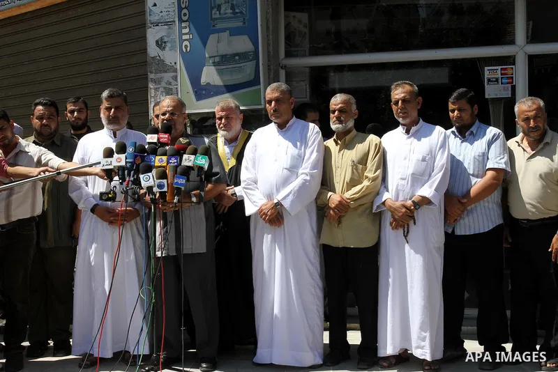 Members of the Palestinian Islamic Jihad deliver speech in a press conference in Gaza city on Aug. 23, 2011 in support with the Libyan rebels . Photo by Mohammed Asad