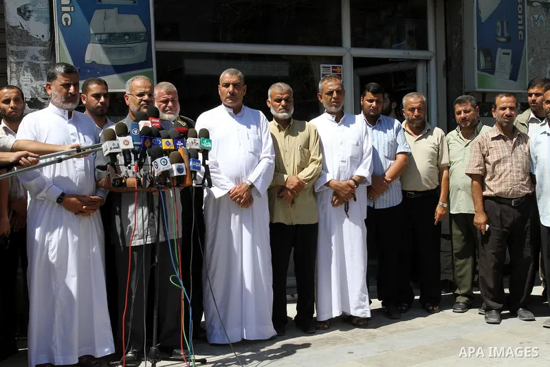 Members of the Palestinian Islamic Jihad deliver speech in a press conference in Gaza city on Aug. 23, 2011 in support with the Libyan rebels . Photo by Mohammed Asad