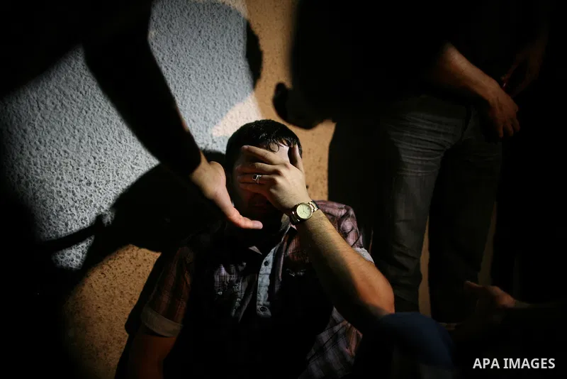 Palestinian relatives mourn over the body of Islamic Jihad militant Atia Moqat at El-shifa hospital after an Israeli air strike in Gaza City on 24 August 2011. Photo by Mahmud Nassar