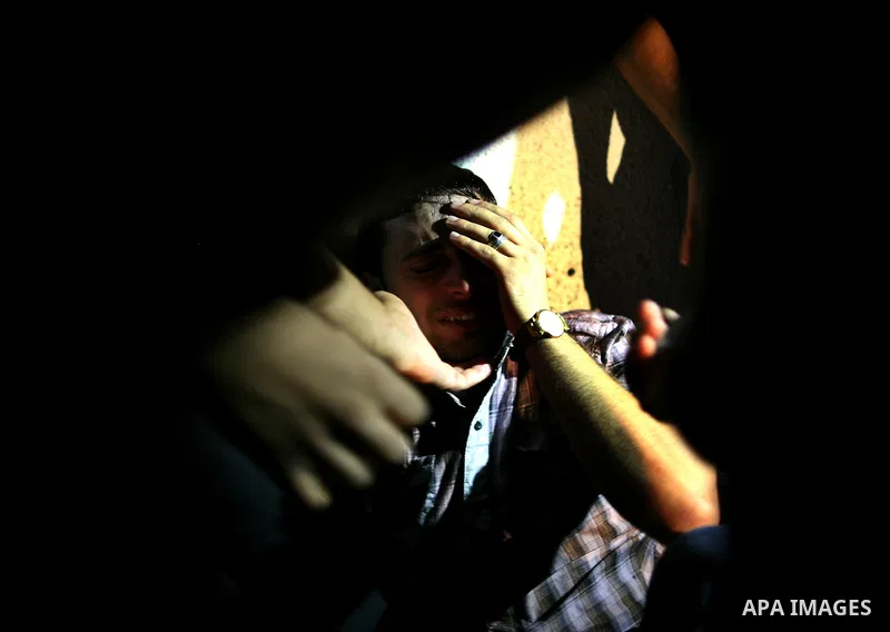 Palestinian relatives mourn over the body of Islamic Jihad militant Atia Moqat at El-shifa hospital after an Israeli air strike in Gaza City on 24 August 2011. Photo by Mahmud Nassar